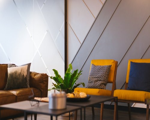 A group of colleagues having a relaxed conversation in a bright modern office in Peru